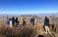 Students on a mountain ridge